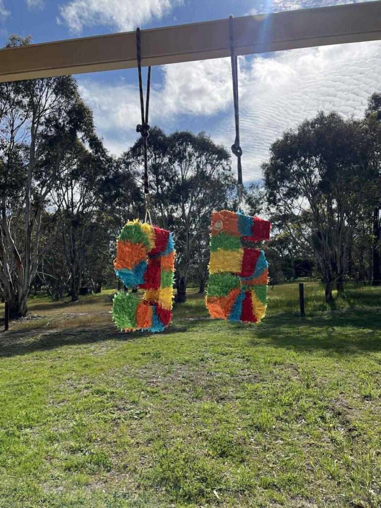 All That Glitters: Celebrating My 30th Birthday In Style! 🎉 Two birthday piñatas forming the number 95.